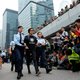 Singer and actress Denise Ho is taken away by policewomen in Hong Kong in 2014.